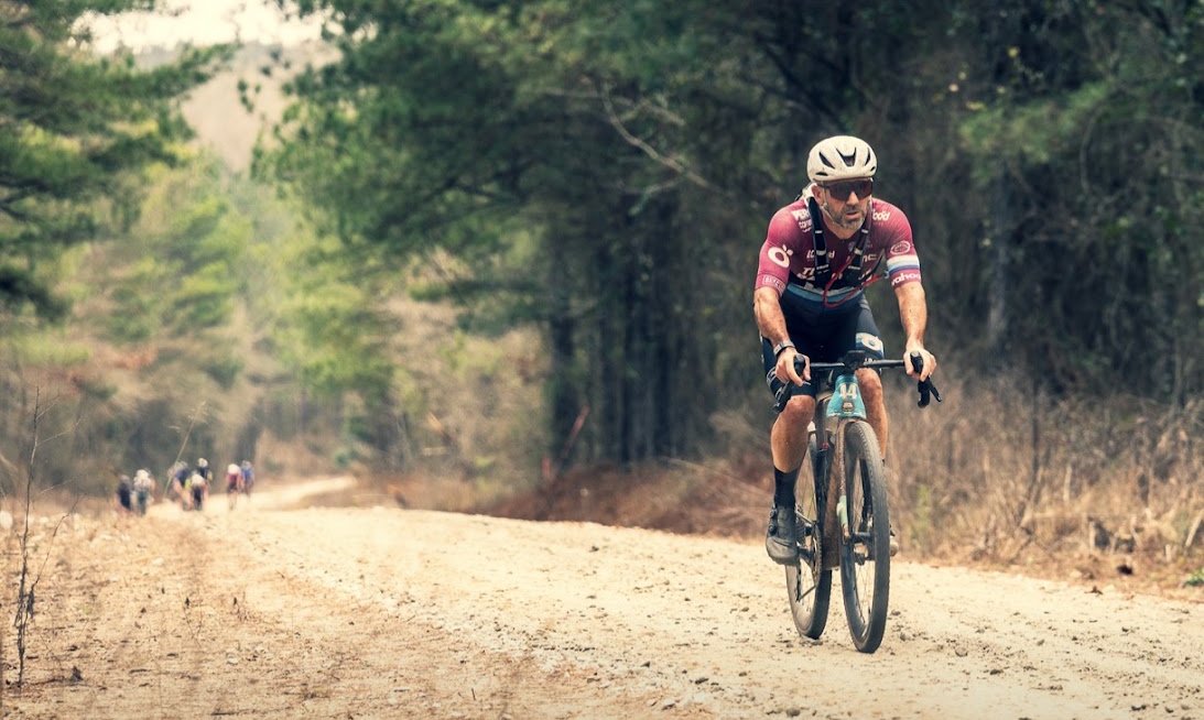 Coach racing on a gravel road