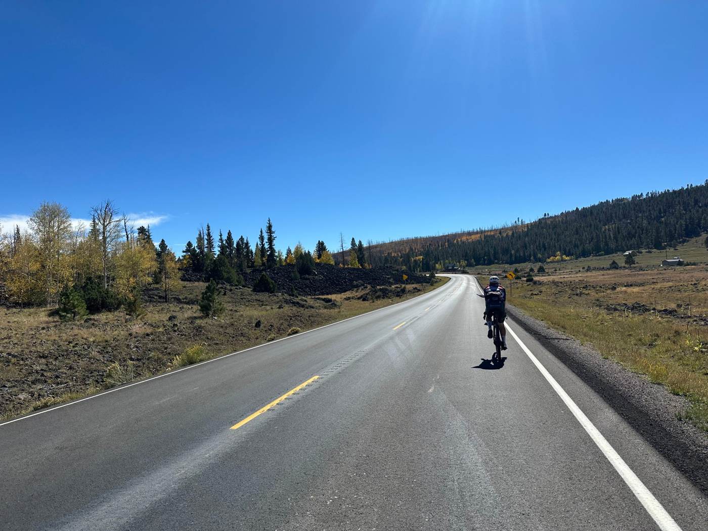 Cyclist riding a mountain road